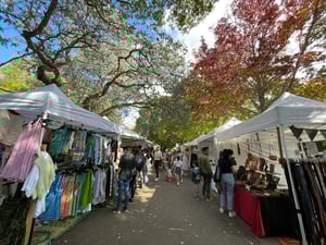 pop up stores outside showing clothes and other items to buy