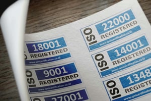 a sheet of paper saying ISO registered  